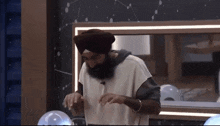 a man with a beard is wearing a turban