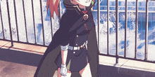 a girl in a cape stands in front of a railing