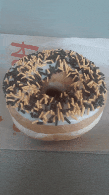 Tim Hortons Vanilla Dip Donuts GIF - Tim Hortons Vanilla Dip Donuts Vanilla Dip With Halloween Sprinkles GIFs