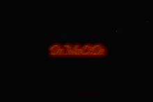 a neon sign that says do mocide in red and yellow