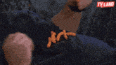 a man laying on a couch with tv land written on the bottom right