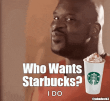 a man is holding a starbucks cup with whipped cream in it