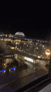 a blurry picture of a city at night with a building that says ' chase ' on it