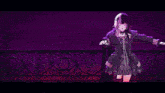 a girl with purple hair is standing in front of a purple light