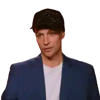 a man wearing a hat and a blue suit says bitch