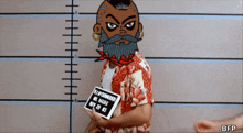 a man with a beard is holding a piece of paper that says " mr. yvonnereis "