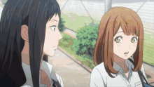 two anime girls are standing next to each other