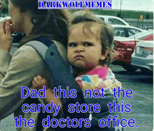 a woman carrying a baby with a caption that says dad this not the candy store this doctors office