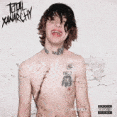 a shirtless man with a tattoo on his chest is on the cover of total anarchy