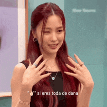 a woman with red hair says " si eres toda de dana " in a foreign language