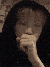 a close up of a person 's face with a hoodie on