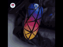 a close up of a nail with a geometric design and the word nails in the corner