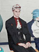 a man in a suit and tie is sitting on a couch