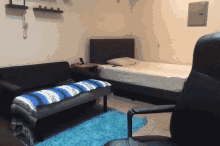 a bedroom with a couch and a bed and a chair