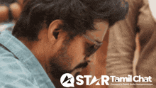 a star tamil chat advertisement with a man in the background