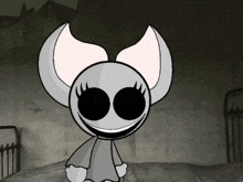 a cartoon character with a bow on its head is sitting on a bed in a dark room