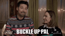 a man and a woman are sitting next to each other with the words buckle up pal on the bottom right