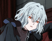 a girl with white hair and red eyes is wearing a black jacket