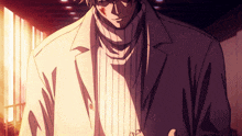 a man wearing a white jacket and a turtleneck sweater