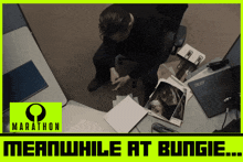 an ad for marathon shows a man sitting at a desk looking at papers