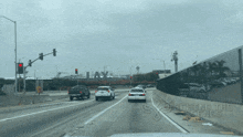 a behind the scenes photo of a highway with a lax sign in the background