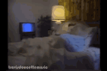 a blurred image of a person laying on a bed with the words travisdoucellemusic written below them