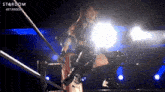 a woman in a wrestling ring with the word stardom written on the bottom