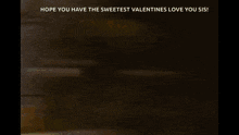 a blurry picture of a woman holding a box of valentine 's day candy .