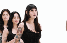 a woman with a tattoo on her arm that says " i am a princess "