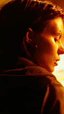 a close up of a woman 's face with a blurred background