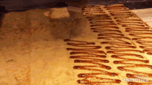 a piece of cake with caramel sauce being poured on it is made in animatica