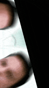 a blurred image of a person 's face with a black border