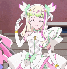 a girl in a white dress with a heart on her chest is smiling