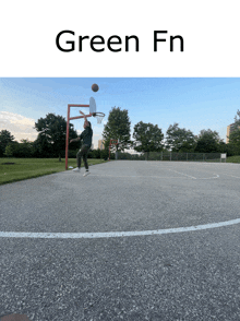 a man playing basketball on a court with the words green fn on the bottom