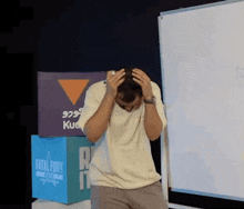 a man is standing in front of a white board that says fatal fury on it