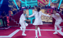 a woman in white boots is dancing on a stage