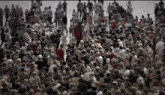 a large crowd of people are gathered in a large area