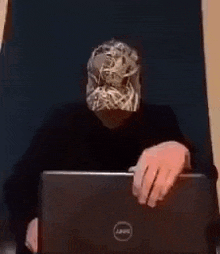 a blurry picture of a person holding a laptop computer .