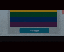 a rainbow flag with a play again button in the corner