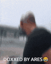 a blurry picture of a man with the words doxxed by ares