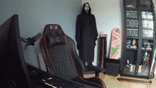 a scream mask is hanging on a wall next to a chair that says skill