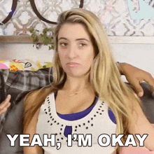 a woman says yeah i 'm okay in front of a man