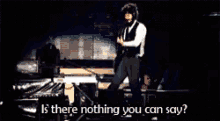 a man in a white shirt is playing a guitar and says " is there nothing you can say " .