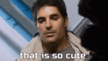 a man is sitting in a chair with the words `` that is so cute '' written on his face .