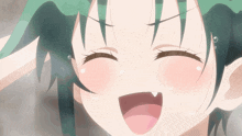 a close up of a girl with green hair making a face