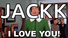 a man in a green jacket says jackk i love you in front of a group of people .