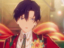 a close up of a boy in a red suit and tie .