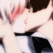a man and a woman are kissing each other in an anime scene .