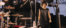 a man wearing a black tank top that says onedreams on it