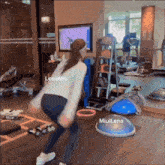 a woman is doing exercises in a gym with lenamiu and miullena written on the floor